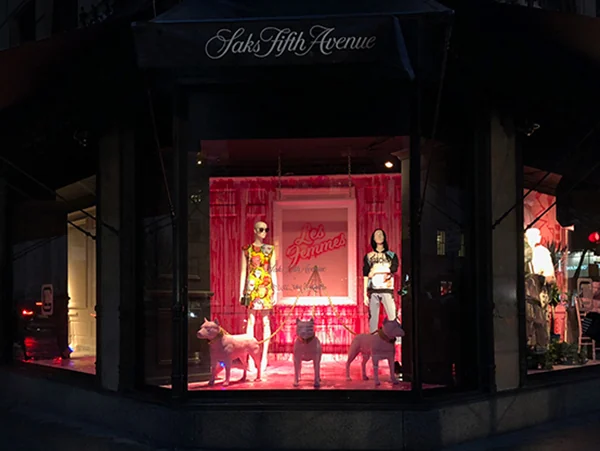 Artwork and sculptural dogs in a Saks Fifth Avenue window